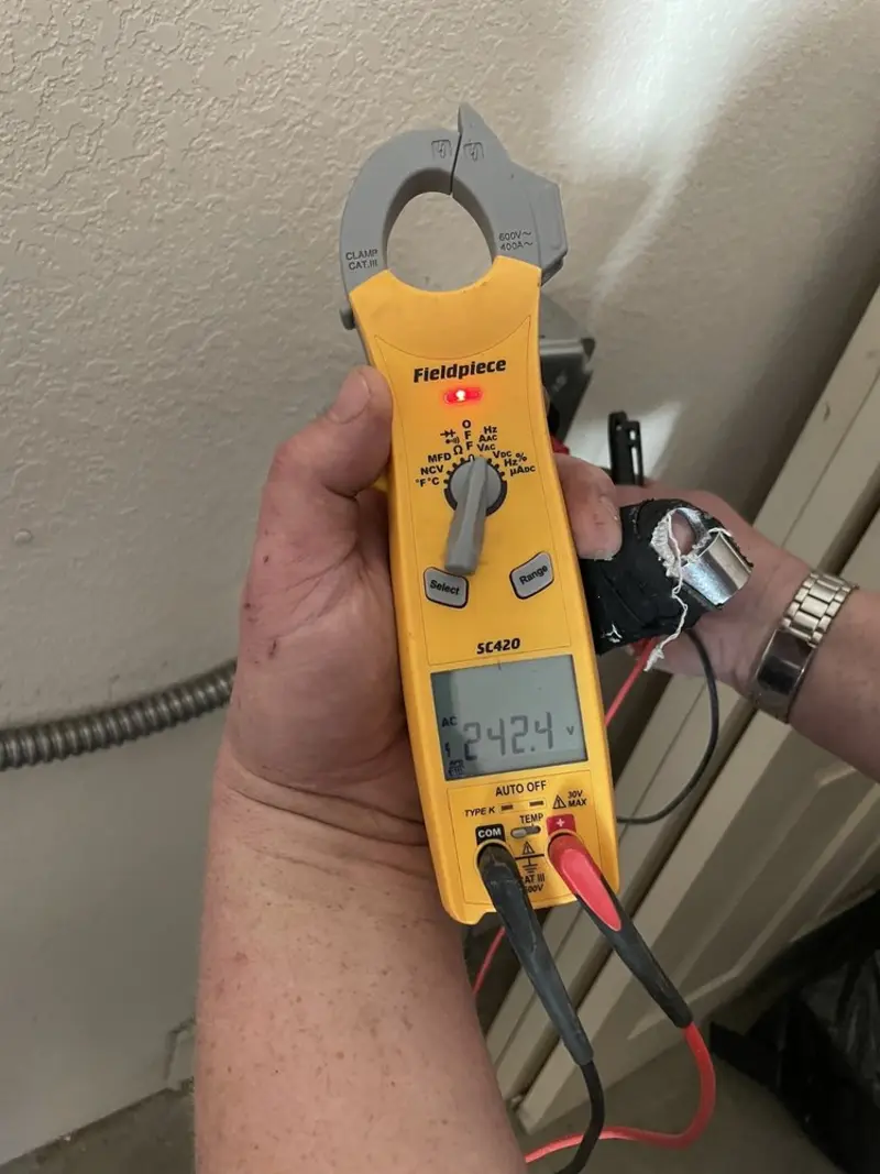Voltage testing with clamp meter during Generator Installation in Highland City